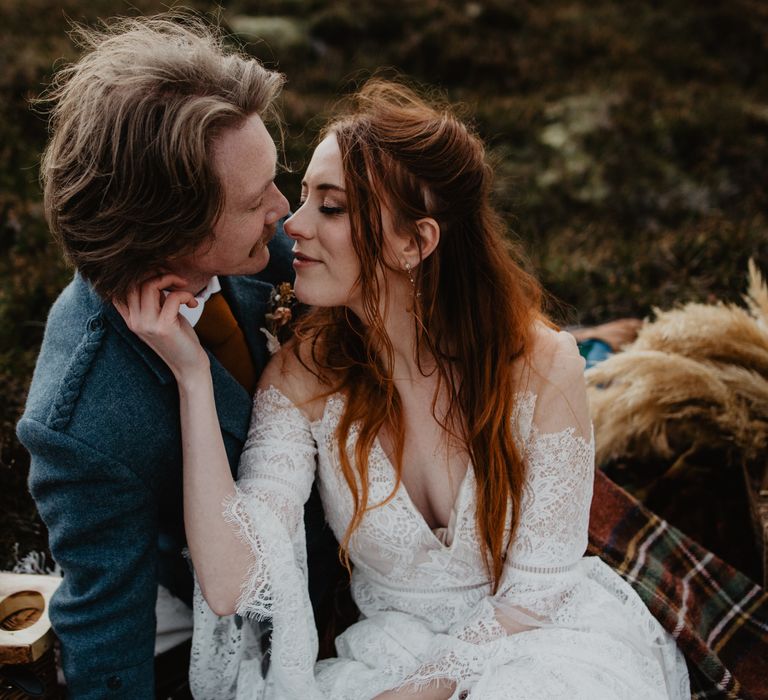 Bride leans in to kiss groom on their wedding day