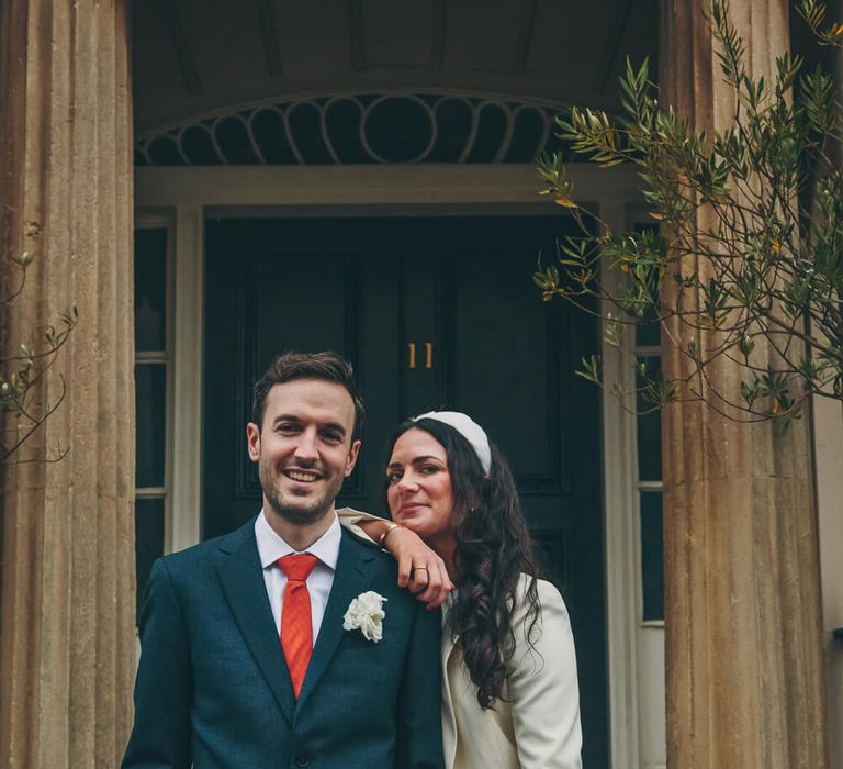 Bride and groom outside wedding venue