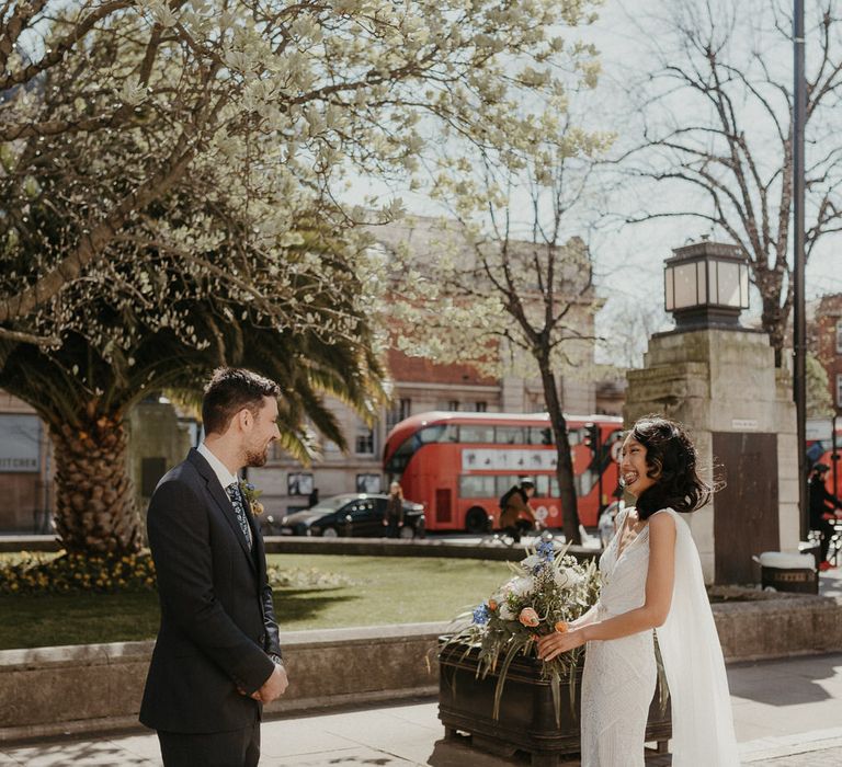 First step outside Hackney Town Hall with the bride in an Eliza Jane Howell wedding dress