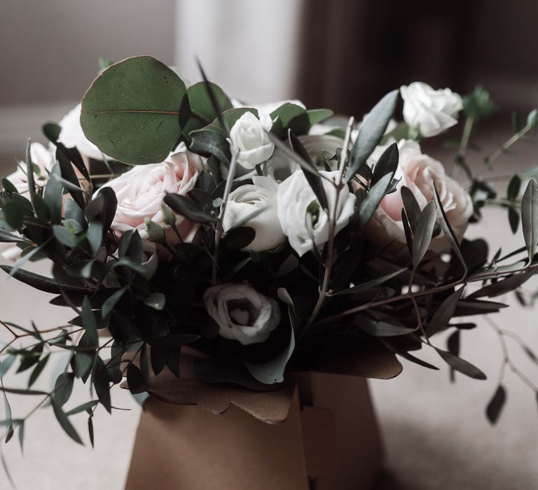 White and pink rose wedding bouquet in a square box