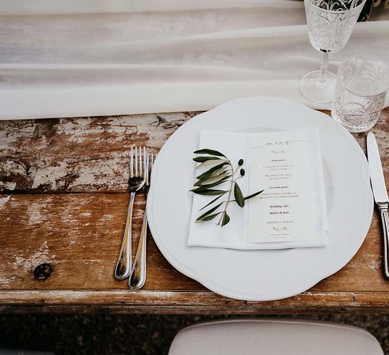 White plate complete with classic stationery and sprig of olive  | Royal Studio