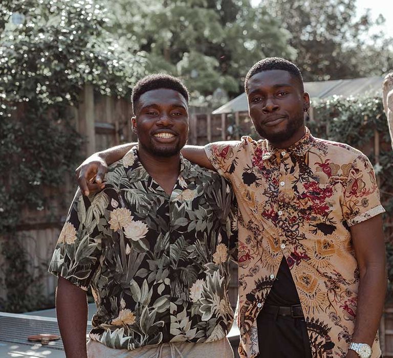 Wedding guests wearing colourful traditional Ghanaian shirts for Airbnb wedding | Imogen Eve Photography