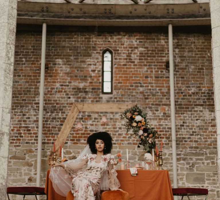 Chiddingstone Castle wedding inspiration with hexagon backdrop, intimate tables cape and pink bride and groom outfits 