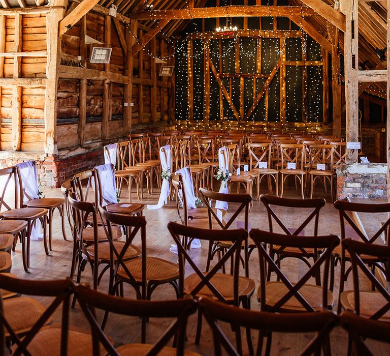 Rustic barn Silchester Farm wedding venue decorated with plenty of fairy lights 