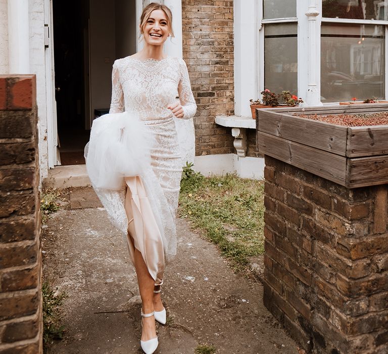 Bride wears Calla Blanche wedding dress with long sleeves 