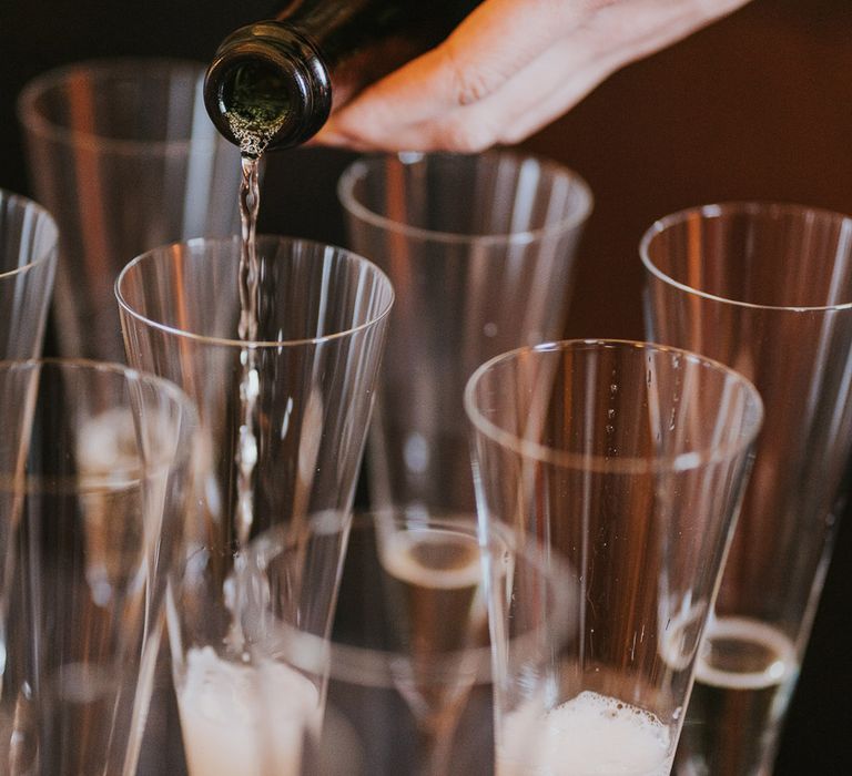 Champagne is poured for guests to drink 