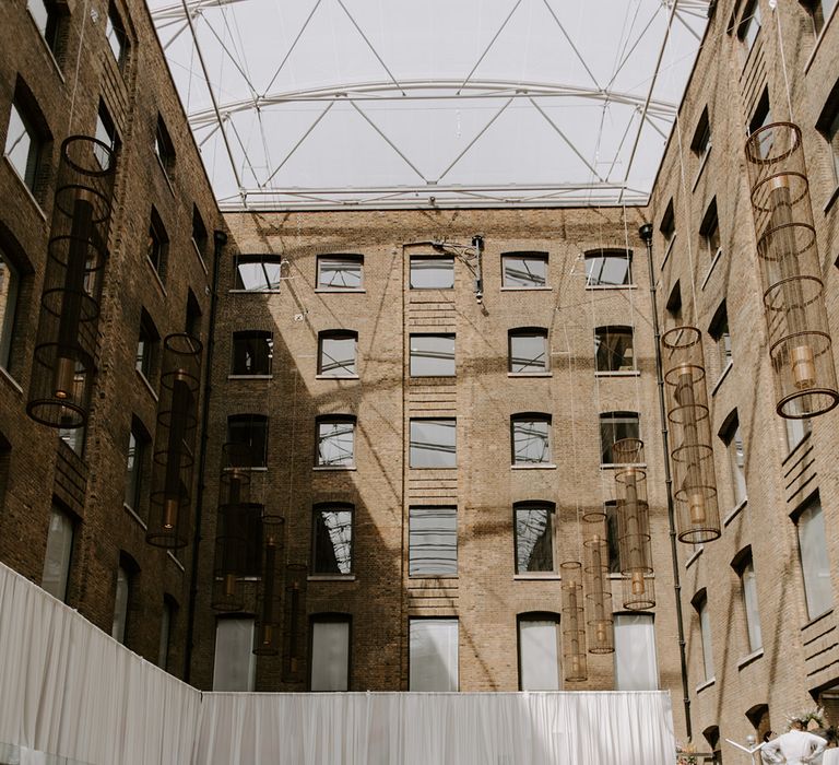 U-shaped wedding reception tables at outdoor area at Devonshire Terrace in London 