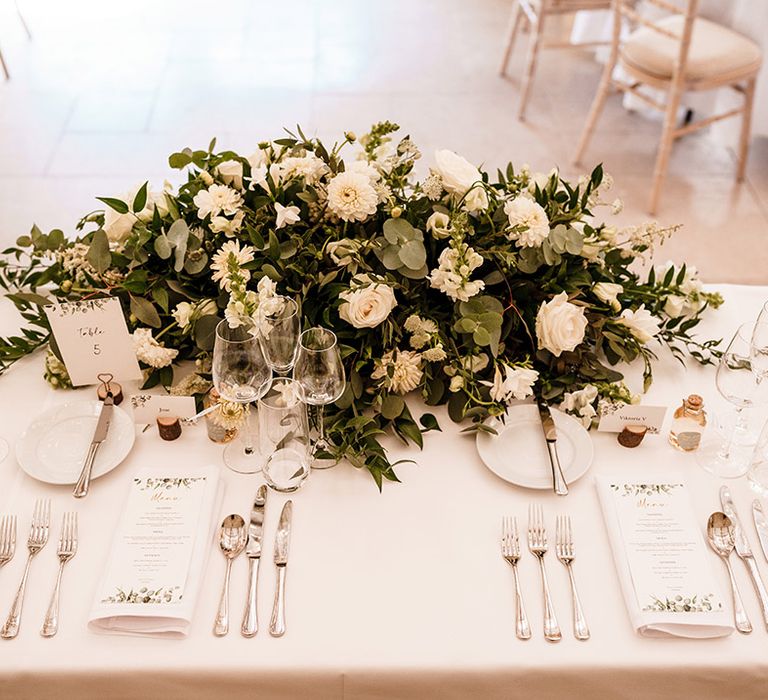 white and green top table wedding flower arrangement 