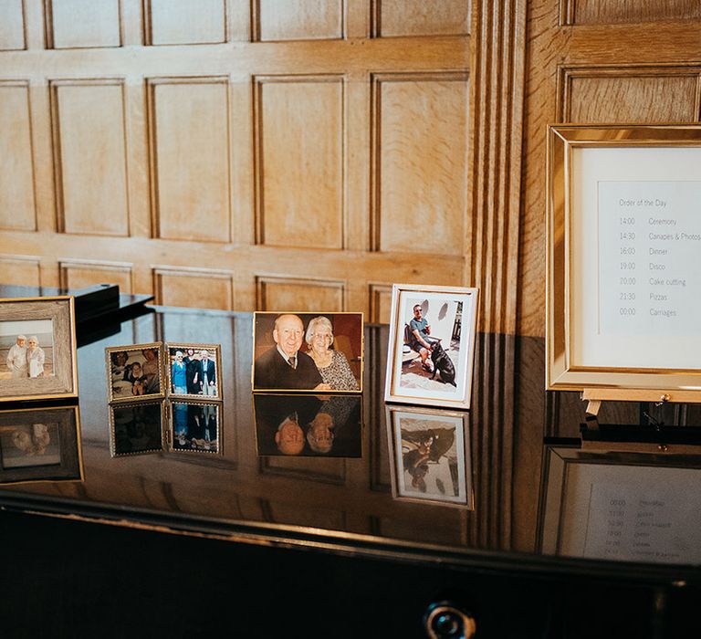 Coombe Lodge wedding with decor and photo frames commemorating lost loved ones 