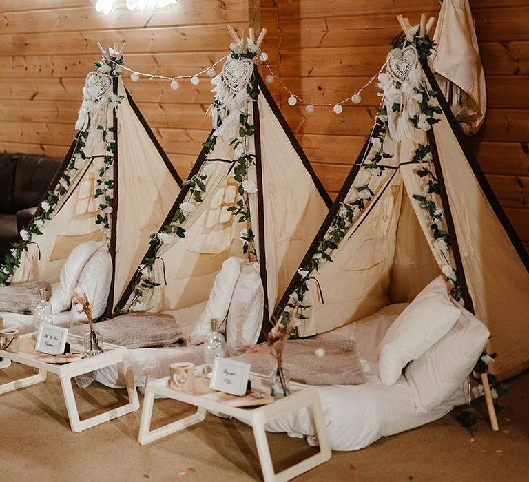 Creche area for children to rest and relax with mini tipis and beds 