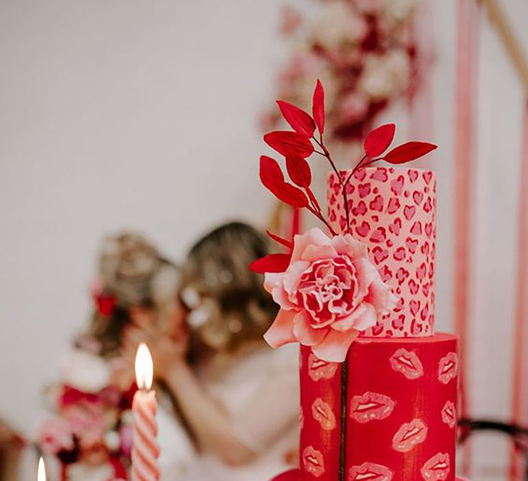 Pink and red wedding cake with lip design and different tiers by Gabrielas Photography and Film during Valentines shoot