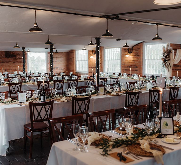 The West Mill in Derbyshire with industrial wedding with boho flowers, pampas grass and fairy light decorations 