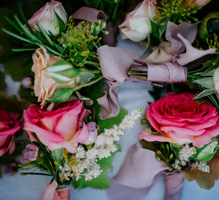 Pink rose buttonholes grooms and groomsmen accessories 