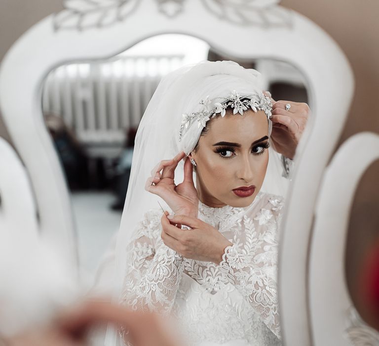 Bride putting on her hijab