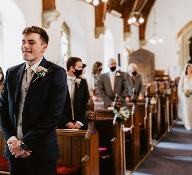 Groom waiting for bride during ceremony