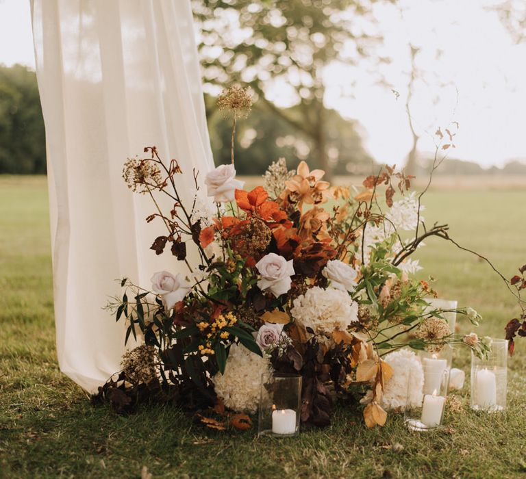 Outdoor wedding ceremony details at Reymerston Hall