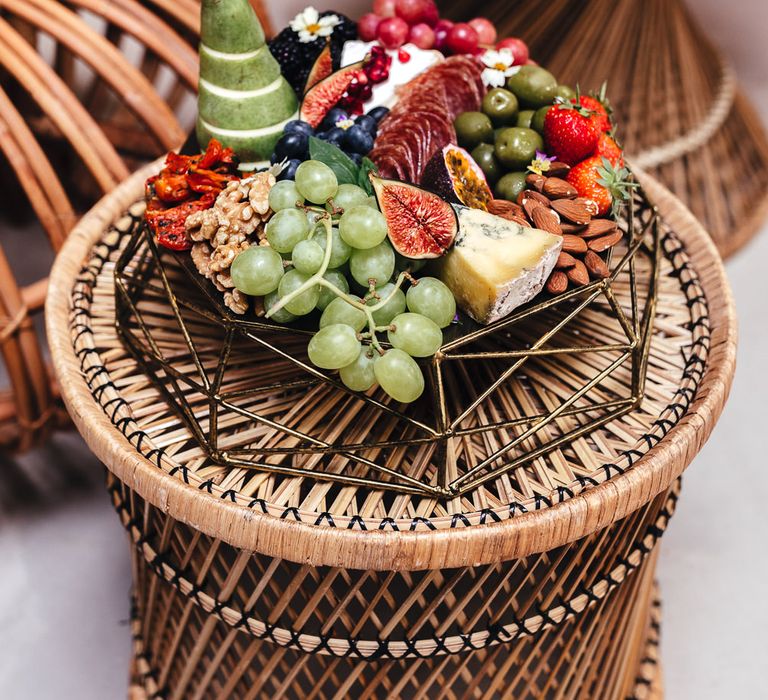 Grazing platter on top of wooden weaved table