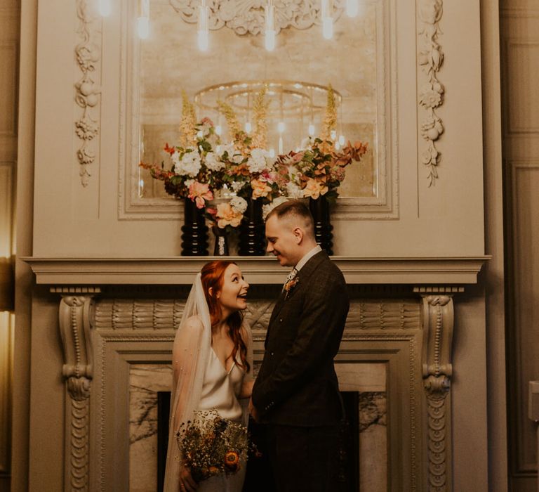 Bride and groom laughing at  old marleybone town hall