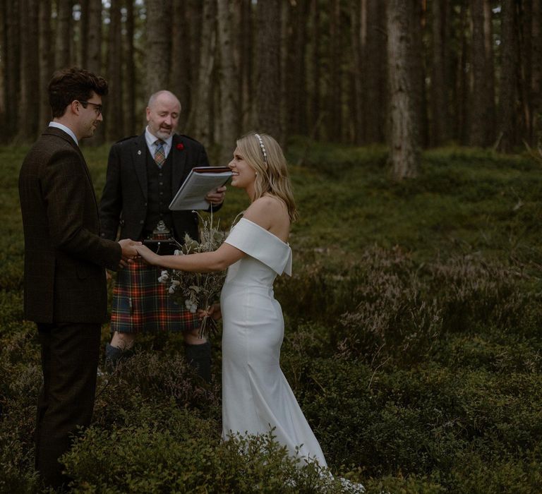 Bride & groom during handfasting ceremony in Scottish elopement