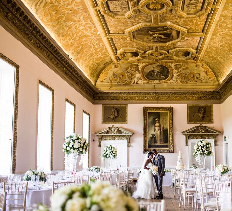 Elegant & classic gilded room complete with white floral displays