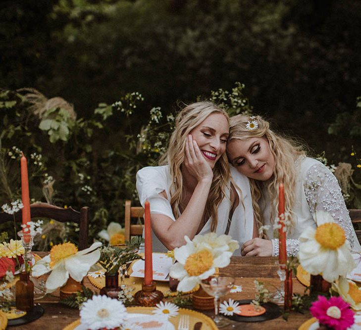 sixties wedding table decor with wildflowers, taper candles, yellow placemats and records 