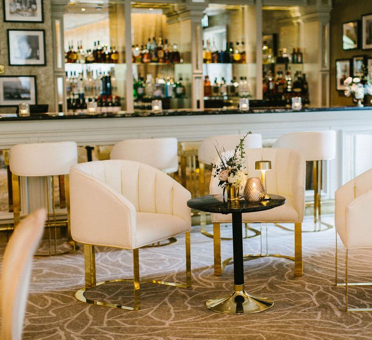 elegant lobby at Grantley Hall wedding venue with cream and gold chairs