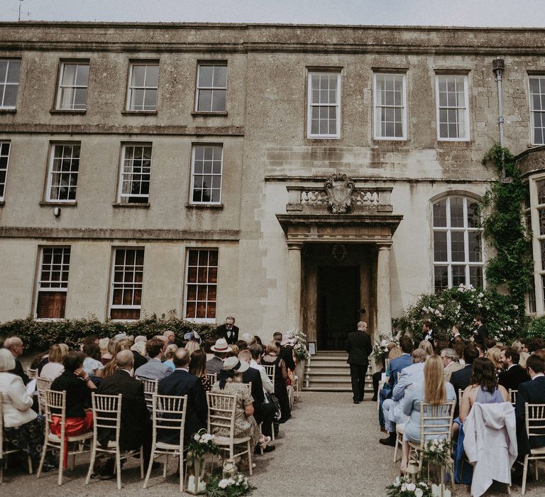 Elmore Court on the morning of wedding for outdoor ceremony in front of historic building with large doorway