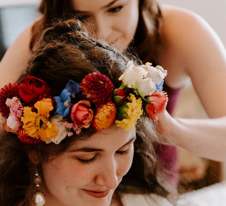 Bride wears brightly coloured floral crown