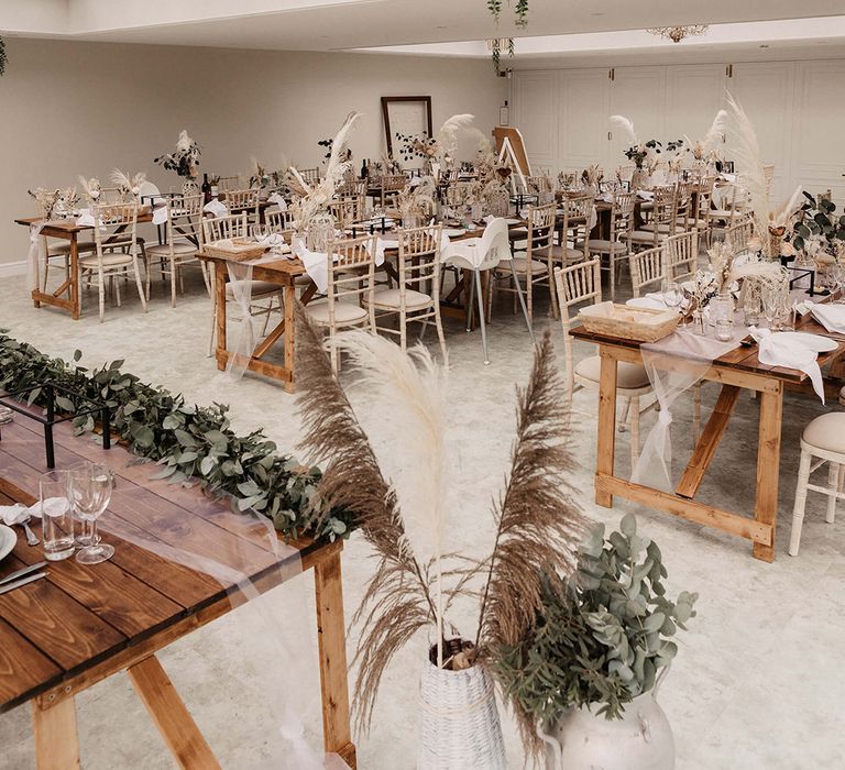 Open and light wedding reception venue complete with dried florals 