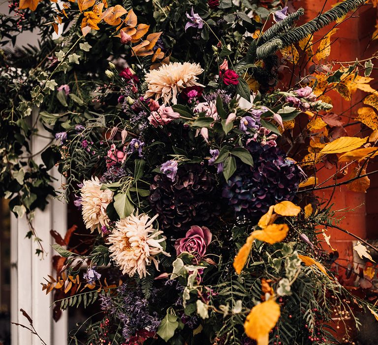 A mixture of autumn coloured flower arrangement 