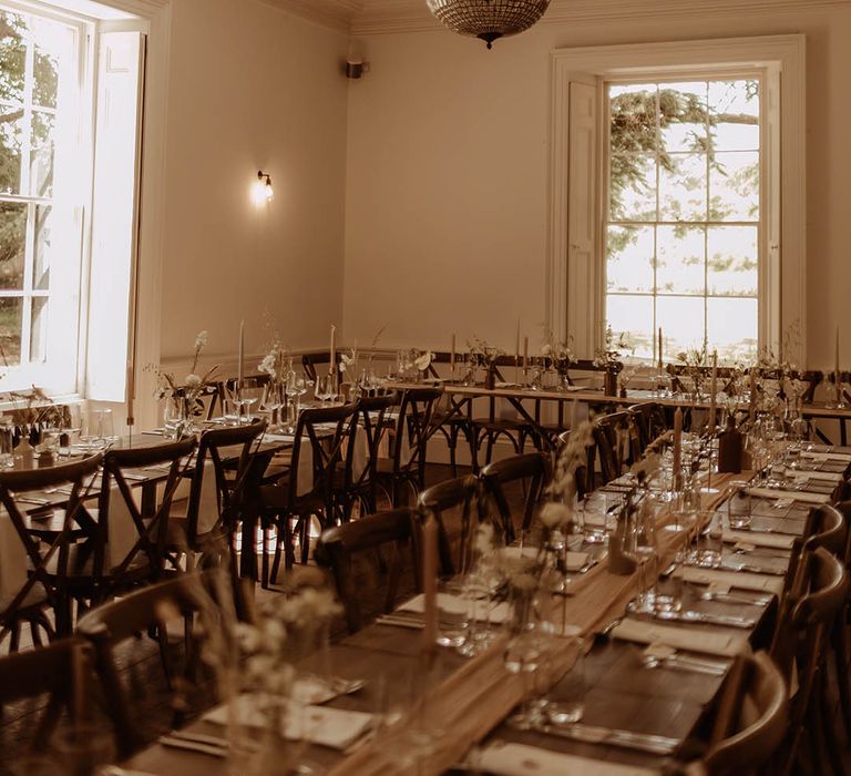 Boho luxe wedding table settings with minimal decor including dried grasses and neutral coloured candles 