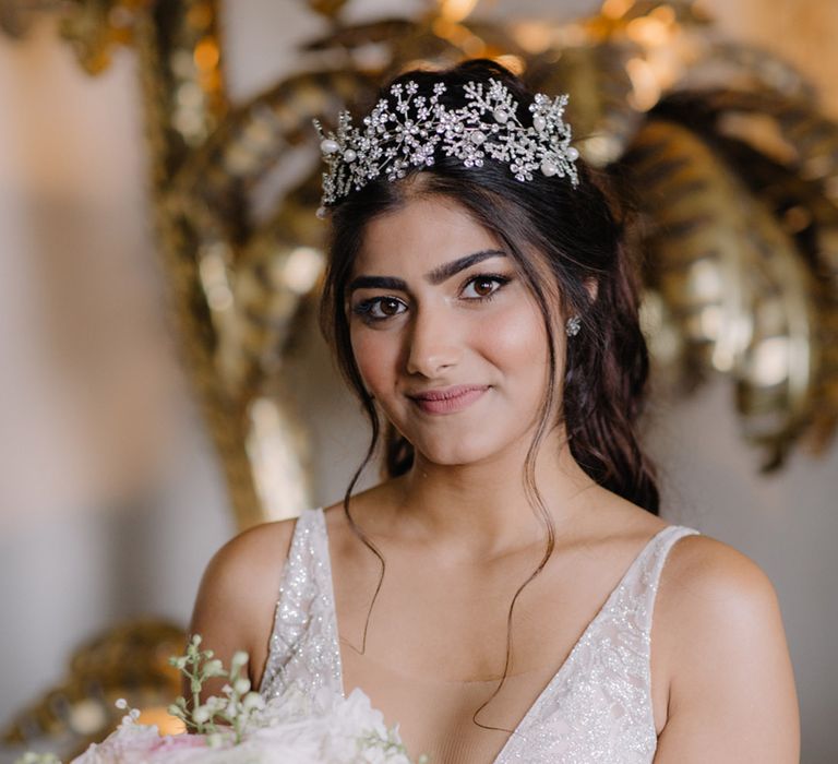  Bride wearing a sparkly and pearl tiara 