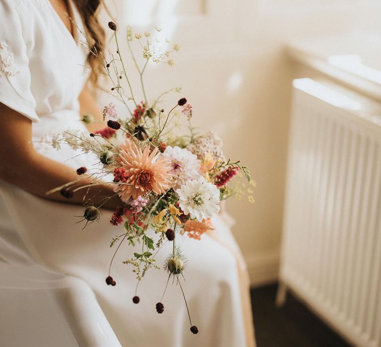 Minimal rustic wedding flowers that are homegrown or locally sourced for the bridal bouquet with dahlias and cosmos 