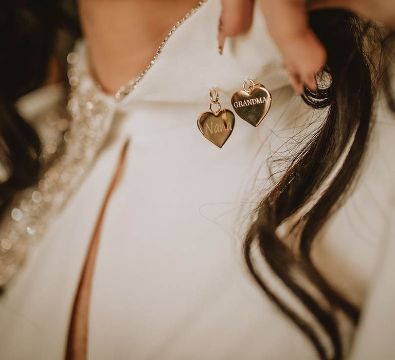 Gold heart engraved wedding necklace worn by the bride on her wedding day 