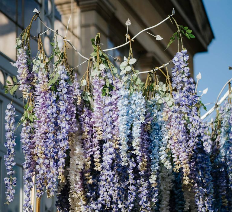 Suspended pastel flower arrangements at Syon Park vow renewal 