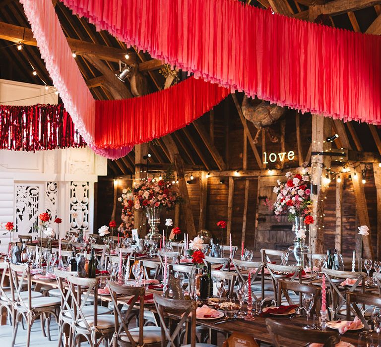 Pink and red wedding streamer decorations at Preston Court wedding venue with booze bath and more 