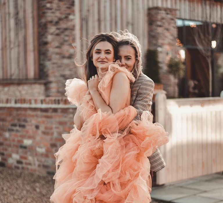 Bride in tulle ruffle pinky peach wedding dress for bride 