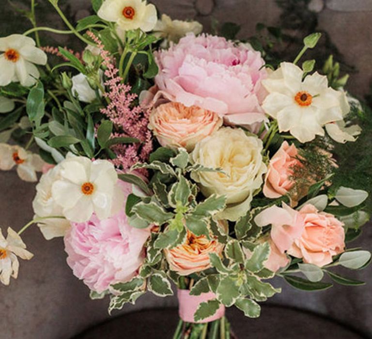 Beautiful wedding bouquet with white and pink wedding flowers and foliage 