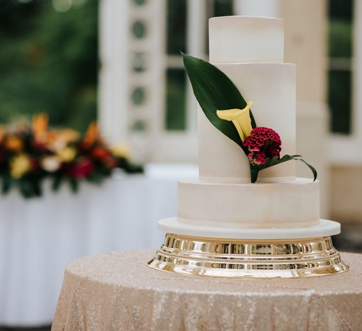 white wedding cake with floral decor