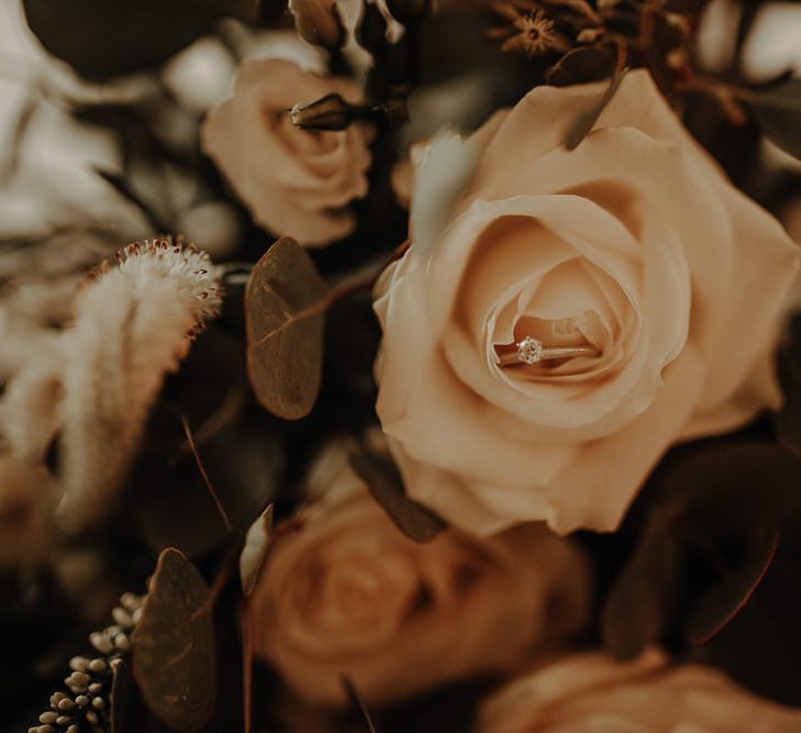 Wedding ring placed in a beautiful white rose on the morning of the wedding