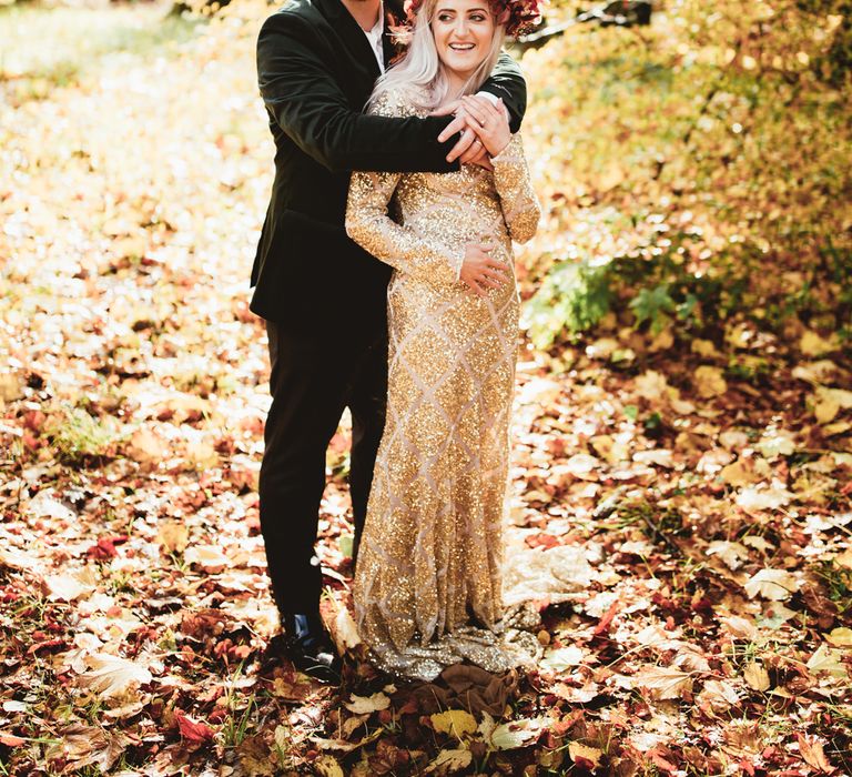 Bride and groom laughing in woodland. Photography by Maryanne Weddings.