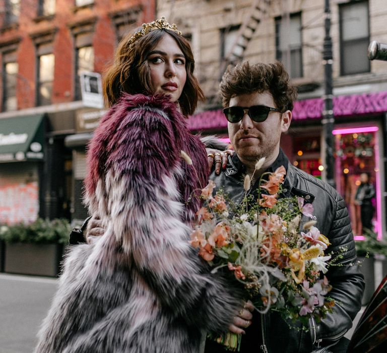 Bride & groom with Autumnal floral bouquet in edgy New York elopement