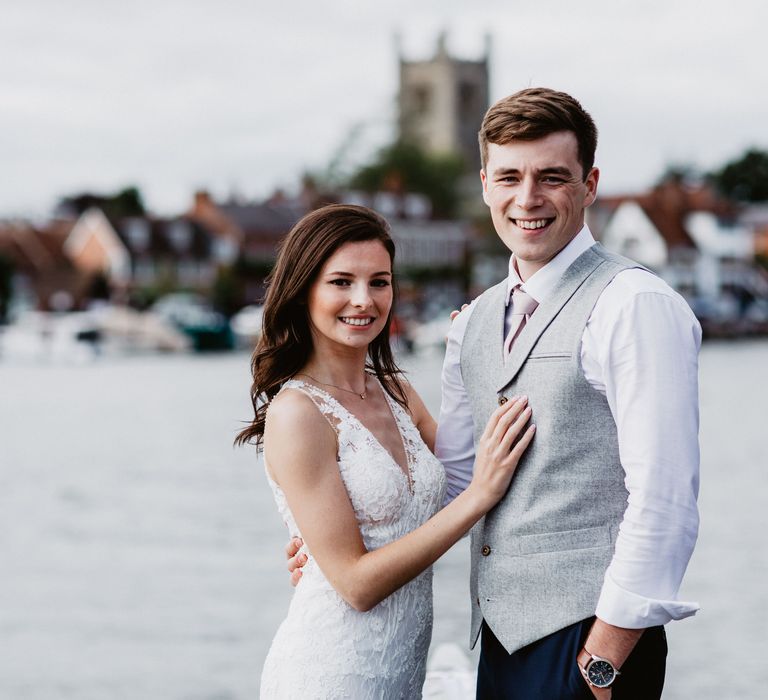 Bride & groom pose on wedding day 