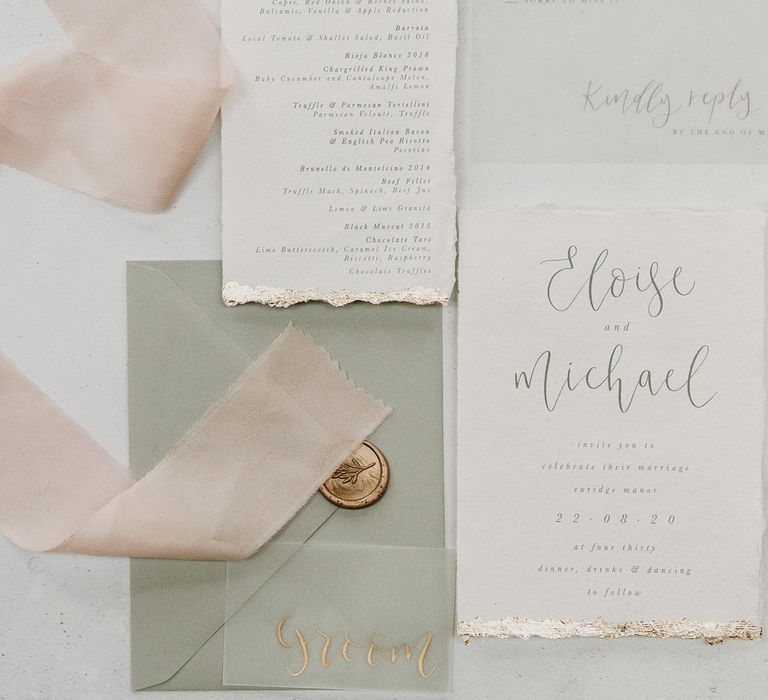 White wedding stationery with gold trim and olive green envelope by Lou Paper