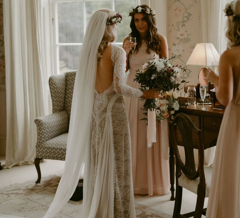 Bride in Grace Loves Lace Wedding Dress, single tier cathedral length veil and flower crown standing with bridesmaids at Drenagh Estate wedding 