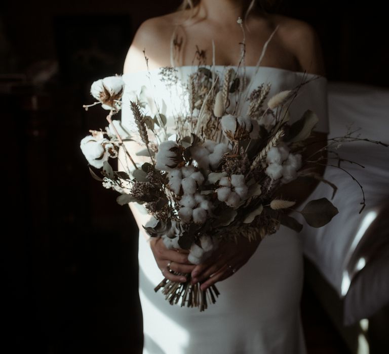 Floral bouquet featuring green foliage and white blooms