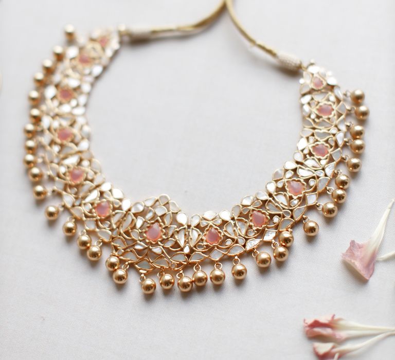 Gold necklace with pale pink stones