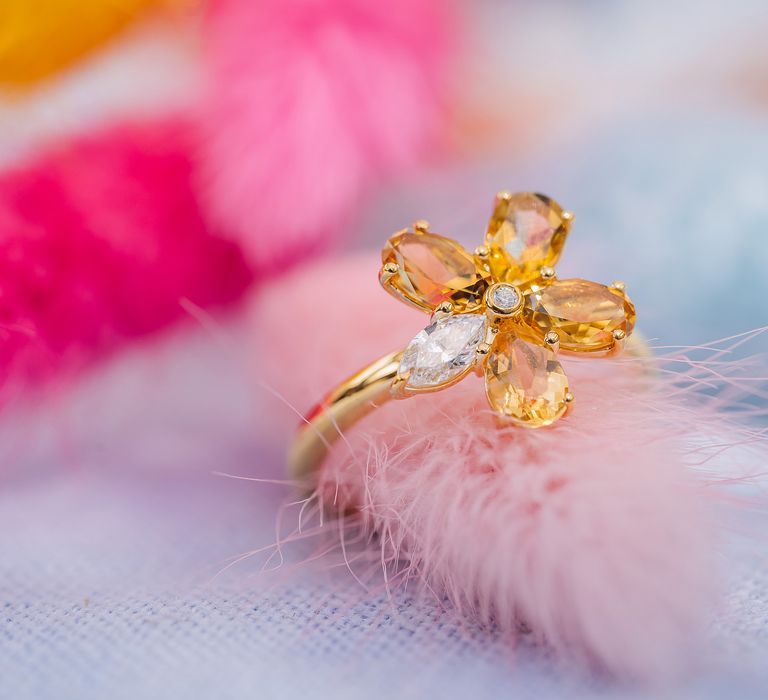 Colourful ring in the shape of flower with diamond centre 