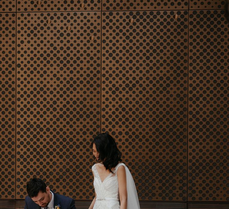 Bride and groom signing their marriage certificate