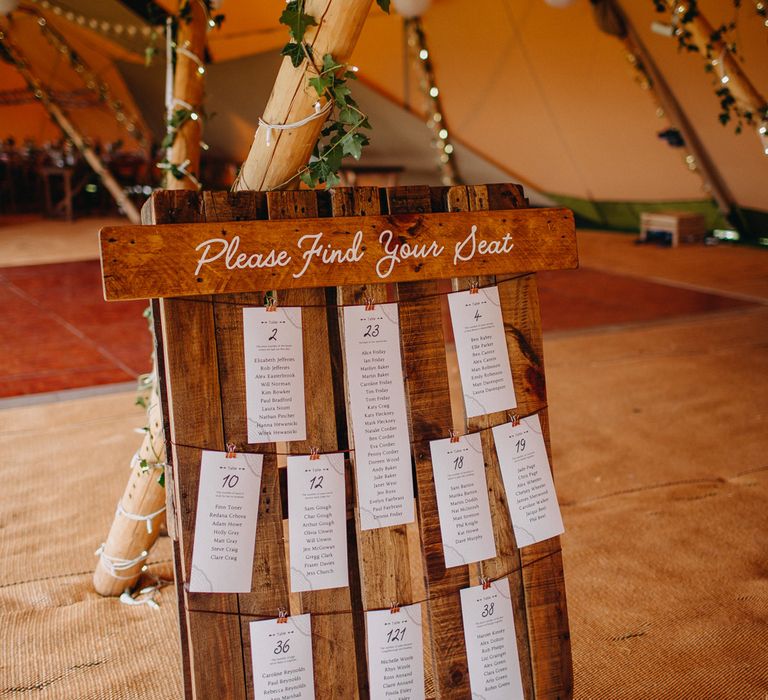 Up cycled wooden palette for seating plan for rustic tipi wedding 